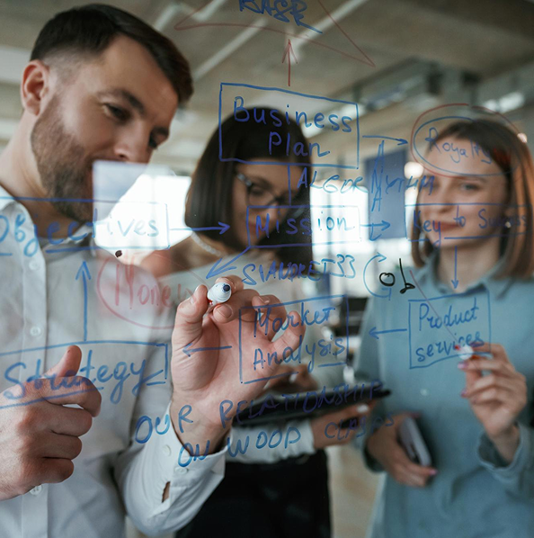 Team collaborating on a whiteboard